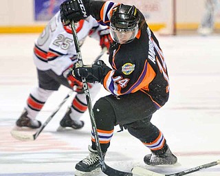 The Youngstown Phantoms Mike Ambrosia (14) moves the puck during a game against the Chicago Steel. Ambrosia, who score 10 goals and had 18 assists last season, is returning to the ice on the Phantoms’ top line with 21-goal scorer Ryan Belonger (16), and newcomer Auston Cangelosi.