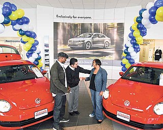 Jaime Garayua, general manager of Stadium Volkswagen in Boardman, presented the keys to two 2012 Volkswagen Beetles to Kimberly Winfrey and Toles. The cars were purchased by Oprah Winfrey, and the taxes and fees were paid by Volkswagen.