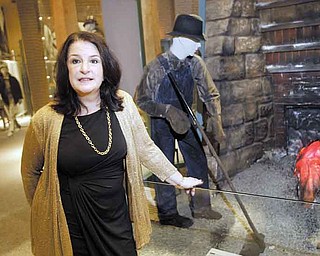 Martha Pallante, Youngstown State University history department chairwoman, tours an exhibit at the Youngstown Historical Center of Industry & Labor during a fundraiser for the museum Thursday.