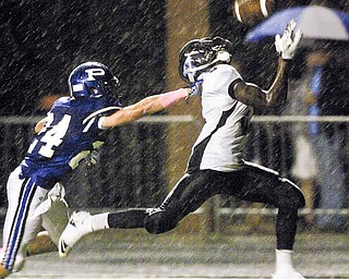 East’s Valentino Sewell (5) hauls down a touchdown pass against Poland’s Connor Schultheis during their Week 8 game at Poland High School Stadium.