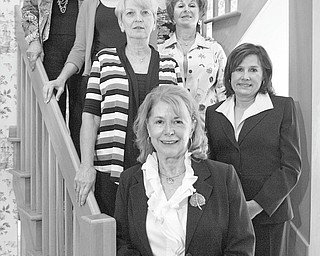 JESSICA M. KANALAS | THE VINDICATOR: Committee members for the Youngstown Federation of Women’s Clubs’ scholarship luncheon are, from top left, along the bannister, Yvonne Ford, Tamara Sigler, Rusti Puromaki and Barbara Higgins, and, from top right, Suzanne Brown, Catherine Campana and Debra Kostelic. The luncheon will take place at 11:30 a.m. Wednesday at the Holiday Inn in Boardman.