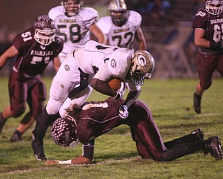 ROBERT K. YOSAY | THE VINDICATOR --..Crossing him down is #1 Bdm D Dayne Hammond as he takes down #25 Brionte Dunn as #51 Bdm Zach Machuga closes in .Glen Oak vs Boardman at Boardman High School -..--30-..(AP Photo/The Vindicator, Robert K. Yosay)