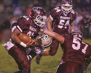 ROBERT K. YOSAY | THE VINDICATOR --..Bdms #21 Devin Campbell breaks free from Glenoak #2 Lunden Butler as he follows the block of #57 Chris Riwniak - #54 Justin Humphreys - as Boardman was driving to the first score to tie the score -.Glen Oak vs Boardman at Boardman High School -..--30-..(AP Photo/The Vindicator, Robert K. Yosay)