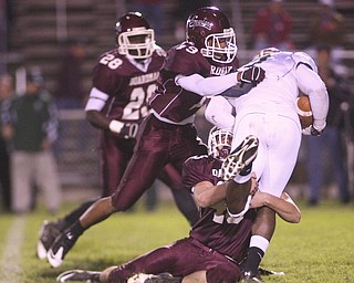 ROBERT K. YOSAY | THE VINDICATOR --..Stopped dead Glenoak #7 Dashawn Hall is corraled and stopped dead in his tracks by Boardman #43 Doug Brandt and #19 Leslie McIntosh as #28 Ivan Adu Poka (ok) - during first quarter action as .Glen Oak vs Boardman at Boardman High School -..--30-..(AP Photo/The Vindicator, Robert K. Yosay)