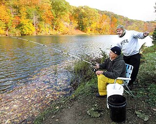 Greg Cappitte, right, and his father, Norm Cappitte, spend Friday afternoon fishing at Lake Glacier in Mill Creek MetroParks. The leaves will reach peak color this weekend, according to The Ohio Department of Natural Resources.