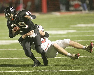 ROBERT K. YOSAY | THE VINDICATOR..Girards #39  Cameren Harden  drags LaBrae player  #5 5 Tyler Carter as he rushes for a first down during second quarter action . ...-30