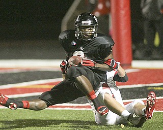 ROBERT K. YOSAY | THE VINDICATOR..Girards #3  Branden Byrd after catching a pass is dragged down by LaBrae #14  Justin Jenkins but he rolled into the endzone for a touchdown  . ...-30