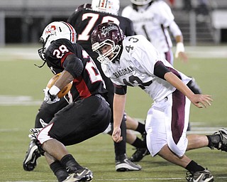 Boardman's #43 Joseph Mikesell looks for the tackle of McKinley's #28 Sa'Veon Holloway on a running play.