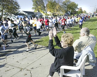 William D. Lewis|The Vindicator Dave and Virginia Adams watch the tart of Peace Race Sunday from their front yard on Kirk Rd.