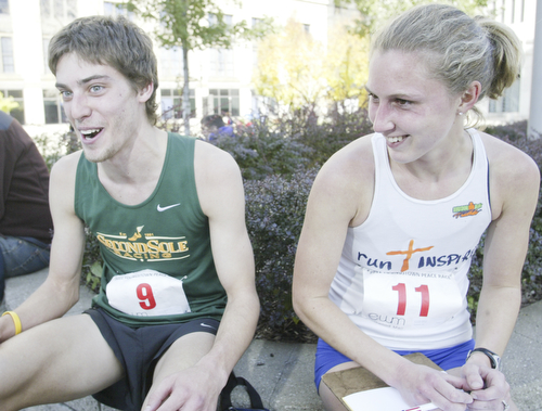 William D. Lewis|The Vindicator Runners and newly weds Andy and Rochelle Morgan at end of race. Andy was 3 rd place runner. They are from Peninsula.