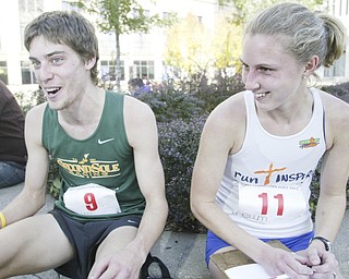 William D. Lewis|The Vindicator Runners and newly weds Andy and Rochelle Morgan at end of race. Andy was 3 rd place runner. They are from Peninsula.