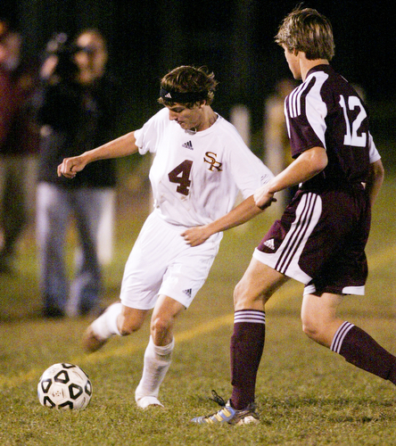 William D Lewis The Vindicator  South Range's  #11 Tyler Ausnehmer keeps the ball from Waterloo'sColin Michalec during Tuesday action at SR.