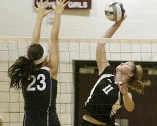 William D. Lewis|The Vindicator Salem's #23 Lindsey Foster defends a shot from Canfield's Sabrina Mangapora Thursday at Boardman.