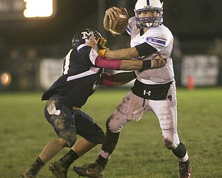 ROBERT  K.  YOSAY  | THE VINDICATOR --..Pushing awa the defender is Western Reserves #6 Jeff Clegg as McDonalds #34   Cody Colburn tries to bring him down - Western Reserve Blue Devils ( white) vs McDonald Blue Devils at McDonald ..--30-..(AP Photo/The Vindicator, Robert K. Yosay)