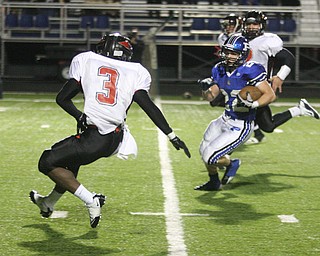 FOOTBALL - (22) Jerry Lawman makes a move on (3) Bryce Jackson Friday night in Poland. - Special to The Vindicator/Nick Mays