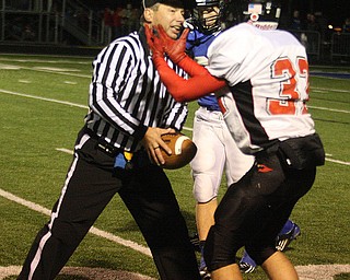 FOOTBALL - (32) Connor Loze of Canfield tells the ref that he had the ball Friday night in Poland. - Special to The Vindicator/Nick Mays