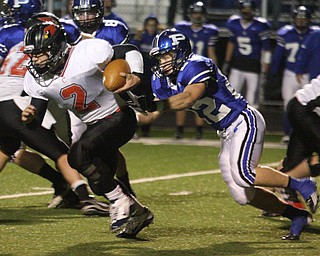 FOOTBALL - (2) Jordan Italiano of Canfield tries to get away from (22) Jerry Lawman Friday night in Poland. - Special to The Vindicator/Nick Mays