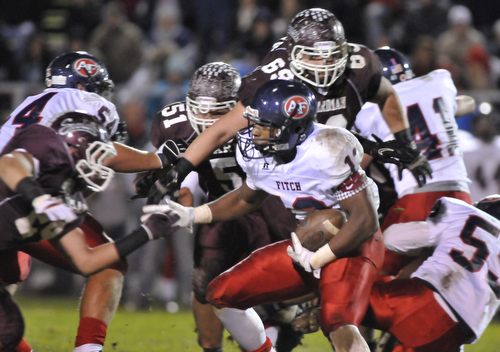 Fitch running back #13 Will Mahone looks for room to run around boardman defenders #44 Shawn Fiffick and #69 Zack Zidian.