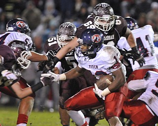 Fitch running back #13 Will Mahone looks for room to run around boardman defenders #44 Shawn Fiffick and #69 Zack Zidian.