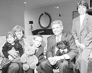 William D. Lewis | The Vindicator: Easter Seals poster children Lily DeMarco, 4, and Cameron Shull, 8, along with committee members,
from left, Susan Rupert, Stan Boney and Carol O’Neill, work to prepare for “Magic of the Angels’ Christmas,” an annual fundraiser.