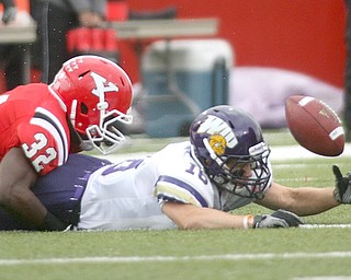 ROBERT K. YOSAY | THE VINDICATOR..Big turnover as YSU  #32 Jordan Thomas makes #16 for WIU Myers Hendrickson cough upthe punt. the  Penguins recovered and scored. .YSU vs Western Illinois - homecoming at YSU and a win 56-14 ......-30