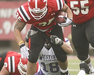 ROBERT K. YOSAY | THE VINDICATOR..Jamaine Cook YSU  drags WIU Tim Franken as Jamaine gets a first down during first quarter action..YSU vs Western Illinois - homecoming at YSU and a win 56-14 ......-30