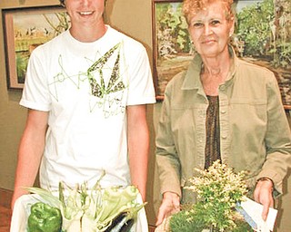 Robert Voland and Dianna Mullins show off their respective youth and adult Best of Show winning entries in the Men’s Garden Club of Youngstown’s 47th Horticultural Show, which took place recently at Fellows Riverside Gardens.