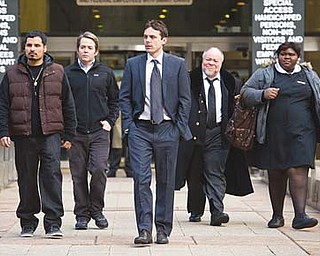 From left, Michael Peña, Matthew Broderick, Casey Affleck, Stephen McKinley Henderson and Gabourey Sidibe star in “Tower Heist,” an action comedy about working stiffs who seek revenge on the Wall Street swindler who stiffed them.
