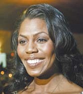 Reality-TV personality Omarosa Manigault-Stallworth spoke with reporters Thursday at the Greater Warren-Youngstown Urban League dinner in Niles.