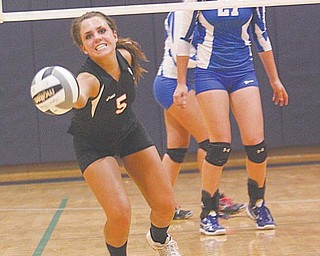 Mineral Ridge’s Lea Whitmer (5) makes a play on the ball during a Division IV regional volleyball semifinal Thursday against Jackson-Milton at Solon High School. The Rams downed the BlueJays, 3-0, to advance to the regional final on Saturday against Tuscarawas Central Catholic in Solon.