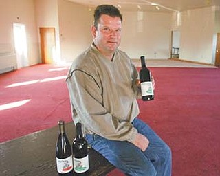 Ron Birchak talks about one of the wines Halliday’s Winery will debut during a Celebrate the Harvest wine-tasting event from 4 to 8 tonight at Olde Dutch Mill Golf Course in Lake Milton.