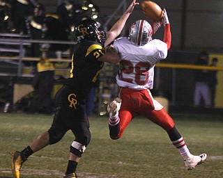 FOOTBALL - (21) Justin Baker of Crestview breaks up a pass as (28) DJ Kleppel can't haul it in during thier game Friday night in Crestview. - Special to The Vindicator/Nick Mays