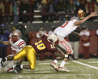 ROBERT K. YOSAY | THE VINDICATOR --..Mooneys #10 Justus Ellis-Moore Takes down Canal Fultons QB #10 Nick Riley causing a fumble as Mooney went on to defeat Canal Fulton - ..Cardinal Mooney Cardinals vs Canal Fulton Northwest Indians at Stambaugh Stadium in the Regional Quarterfinals .--30-..(AP Photo/The Vindicator, Robert K. Yosay)