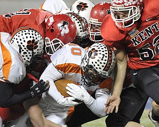 Howland fullback #40 Brandon Miller is tackled by a pack of Kent Roosevelt Roughriders.
