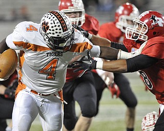 Howland running back DeVeon Smith #4 stiff arms Steven Henderson #8. He would score a touchdown on the play.