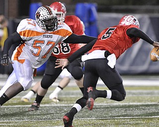 Howland defensive linemen #57 Jayson Freeman puts pressure on Kent Roosevelt #5 TraVon Chapman.