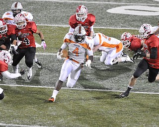 Howland running back #4 DeVon Smith running back cuts back accross the field for extra yards.