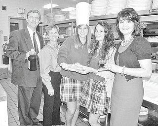 Getting ready to serve up warm, fluffy pancakes on Nov. 13 are, from left, Don Foley, Youngstown Rotary member; Carol Sherman, Rotary member and chairwoman of the pancake breakfast committee; Natalie Parks, Ursuline High School Interact Club; Margherita Bellu, Rotary exchange student from Italy; and Carolyn Korenic, director of alumni and advancement, Ursuline High School.
