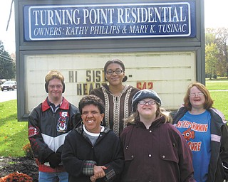 Welcome to an open house: Turning Point Residential/No Limits Day Program invites families, parents and the general public to attend a cookie open house Wednesday to celebrate the opening of its new facility at 5512 Youngstown-Poland Road, Boardman. Above, some of those served by the facility will welcome guests to the open house, which will take place from 11 a.m. to 7 p.m.