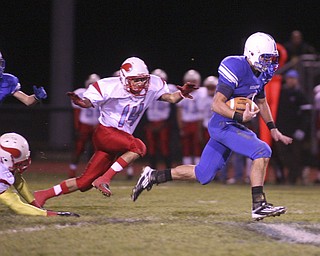 ROBERT K. YOSAY | THE VINDICATOR --..Big run for Blue Devils #2 Donnie Bolton as he ran for a first down and then some as he made it down to almost scoring - Behind him is #14 Mato Vunak for the Vikings..Regional quarter final at Western Reserve Stadium - Western Reserve Blue Devils VS Villa Angela St Joesph Vikings.--30-..(AP Photo/The Vindicator, Robert K. Yosay)