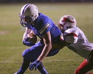 ROBERT K. YOSAY | THE VINDICATOR --..#24 Thomas Benyo almost breaks a tackle by Mato Vunak as he dives for the endzone - he was inches short and the Blue Devils scored on their next Possesion..Regional quarter final at Western Reserve Stadium - Western Reserve Blue Devils VS Villa Angela St Joesph Vikings.--30-..(AP Photo/The Vindicator, Robert K. Yosay)