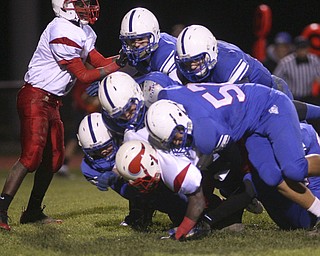 ROBERT K. YOSAY | THE VINDICATOR --..big Sack led by #57 Sam Steininger and a host of blue devils as they smother Anthony Sywanyk the Vikings qb for a big loss..Regional quarter final at Western Reserve Stadium - Western Reserve Blue Devils VS Villa Angela St Joesph Vikings.--30-..(AP Photo/The Vindicator, Robert K. Yosay)