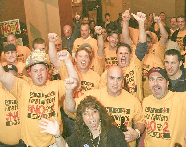 ROBERT K. YOSAY | THE VINDICATOR..Firefighters and policeman and many supporters of defeating issue 2 celebrate at V2 in Downtown Youngstown ..-30