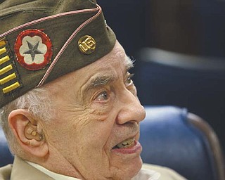 Allen L. Wolkoff of Warren, with a stripe on his hat for every six months in Europe during World War II, talked about his Army experiences and said a Veterans Day service Friday at Temple El Emeth in Liberty “is a nice thing.”