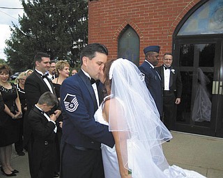 Sgt. Bob Barko Jr., who is Superintendent of Public Affairs at Youngstown Air Reserve Base in Vienna, has been in the military for more than 10 years. He married Deana Creatura in October. Honoring her brother and his new wife is Kerry Geraci of Boardman, who sent in the photo.