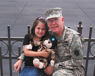 CW5 William T. Sweeney is shown here with Jessica Tirone, his granddaughter, in 2006. Sweeney lives in Boardman and served more than 30 years as an Army helicopter pilot.