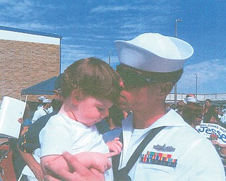 Jason Davis is reunited with his son Jason Davis Jr. after a four-month deployment with the U.S. Navy overseas. They reunited in California and are originally from Austintown. Picture sent in by wife Jana Davis of San Diego, Calif., and mother-in-law Katie Davis of Youngstown.