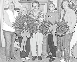 Nick Mays | Special to The Vindicator: Friends of the Children’s Aid Society of Mercer County are planning a holiday fundraiser to support charitable Christmas giving. Members, from left to right, are Liz Bolster, Julie Anhalt, Shirley Young, Betty Hollobaugh, and Mary Calvin. They are showing off some of the wreaths that will be sold this year.