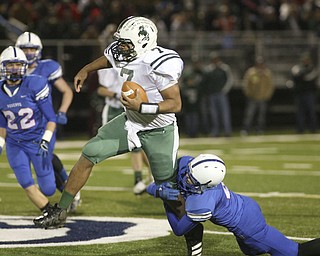 ROBERT K. YOSAY | THE VINDICATOR --..One Legged tackle by Mitch Shahaden as he brings down the QB for Malvern Shawn Ball during first quarter action #22 Jon Timko looks on..Regional quarter final at Western Reserve Stadium - Western Reserve Blue Devils VS Malvern Hornets at Louisville.--30-..(AP Photo/The Vindicator, Robert K. Yosay)