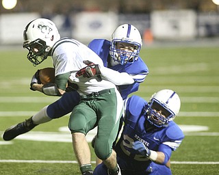 ROBERT K. YOSAY | THE VINDICATOR --..Bg Stop as 22 Jon Timko on the bottom and #13 Parker Warren stop #5 Aaron Enold after a frist down during first half action ..Regional quarter final at Western Reserve Stadium - Western Reserve Blue Devils VS Malvern Hornets at Louisville.--30-..(AP Photo/The Vindicator, Robert K. Yosay)